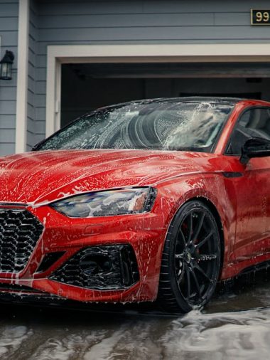 free-photo-of-red-car-being-washed-by-a-garage